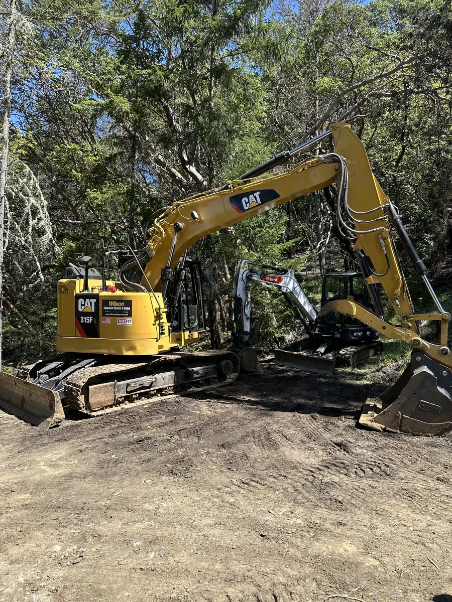Excavator completing earthwork for a Southern Oregon septic project
