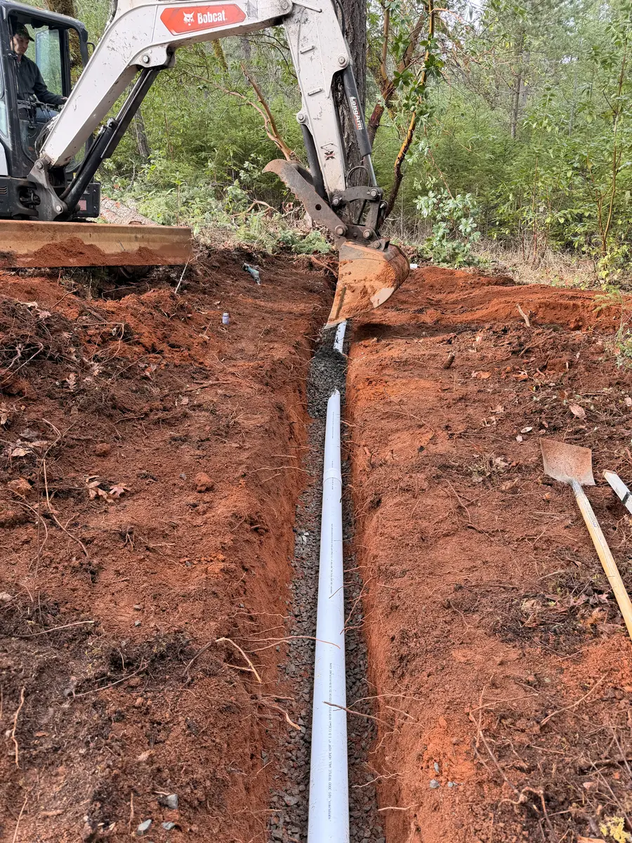 Open utility trench on a Southern Oregon project site